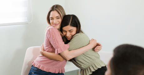 beautiful-young-women-hugging-smiling-after-finishing-group-therapy-session-feeling-happy-overcome-my-mental-health-problems-together 3