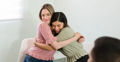 beautiful-young-women-hugging-smiling-after-finishing-group-therapy-session-feeling-happy-overcome-my-mental-health-problems-together 3
